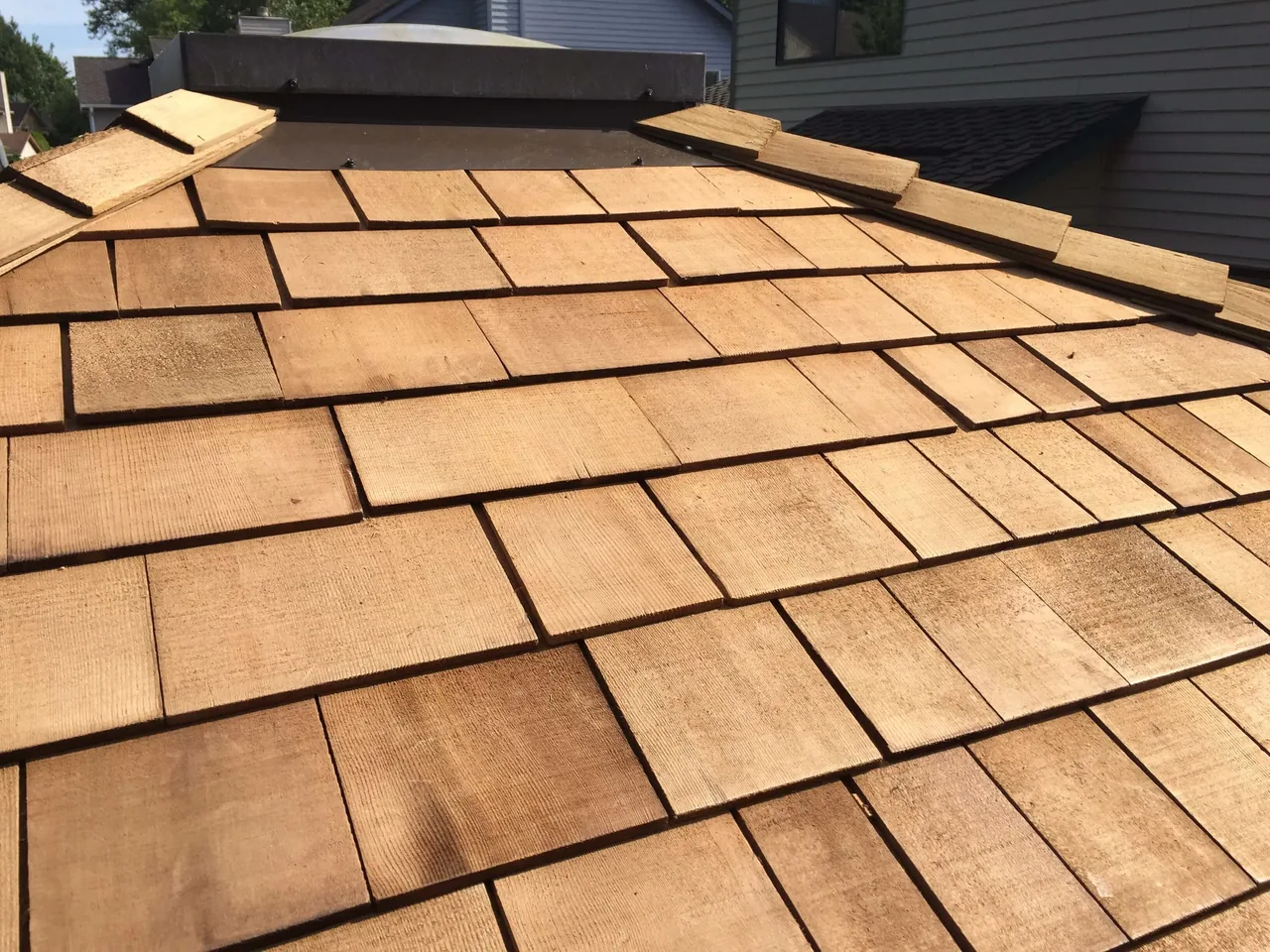 Close view of new cedar shakes and ridge cap pieces, cedar shake roofing
