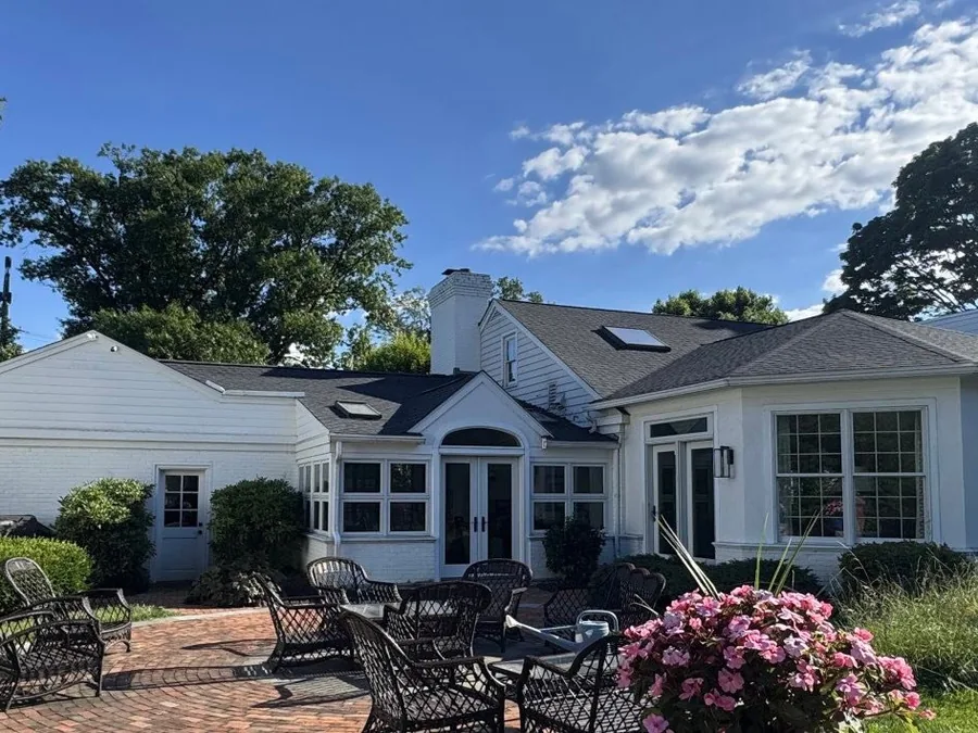 Pool house and patio with a new asphalt shingle roof to match the main house, roof replacement