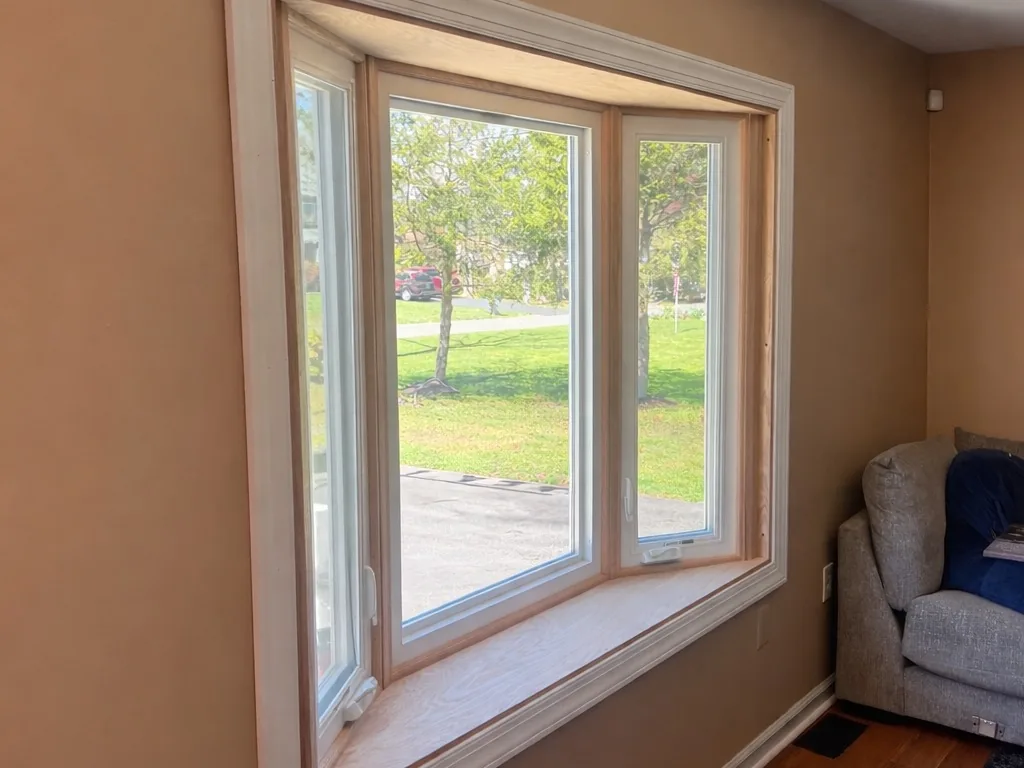 Inside view of a new bay window with wood trim, window replacement